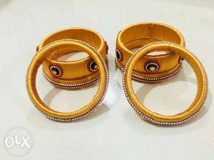 Six Gold-colored Bangle Bracelets