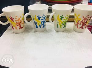 Three White Ceramic Mugs With Lids