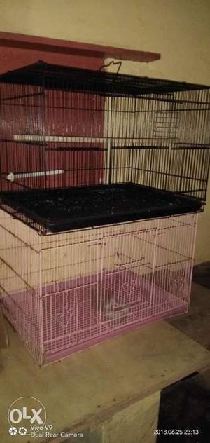Two Black And Pink Wire Pet Cages