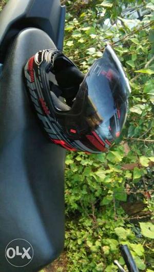 Black, Red, And Gray Full-face Helmet
