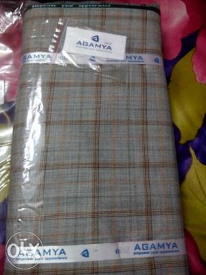 Brand new Suit length in checked cream colour