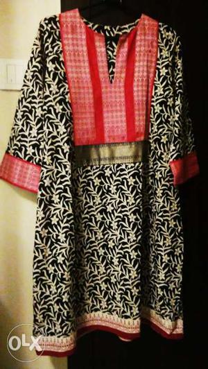Designer cotton kurta with woven borders.