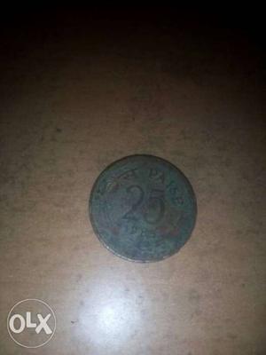 It is a copper 25 paisa coin of 