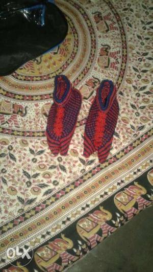 Pair Of Orange Crochet Shoes