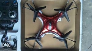 Red And Black Quadcopter With Box