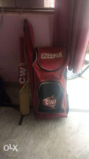 Red CW Cricket Bat And Red And Black CW Backpack