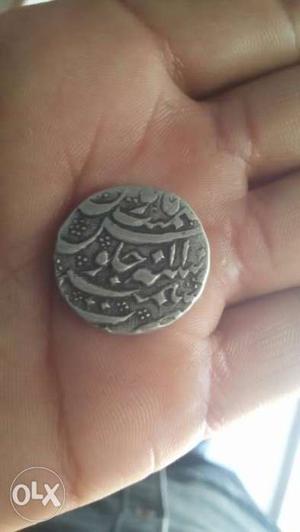 Round Silver-colored Coin of mughal time