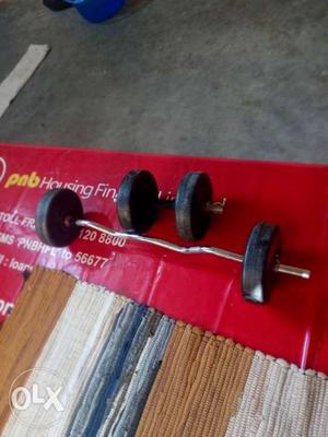 Silver Barbell And Black Fixed Dumbbell