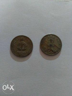 Two Round Gold-colored 25 Indian Coins