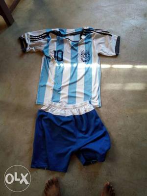 White And Teal Stripe Soccer Jersey And Shorts