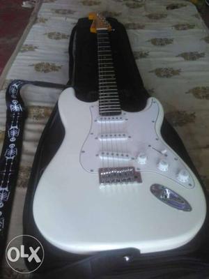 White Stratocaster Guitar With Black Gig Bag