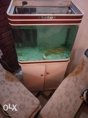 Red And White Framed Fish Tank With Cabinet