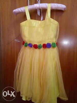 Yellow Elegance..A frock with line of flowers..