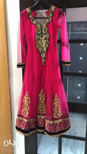 Beautiful coral pink suit with net black dupatta
