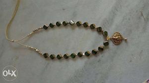 Gold-colored And Black Gemstone Pendant Necklace