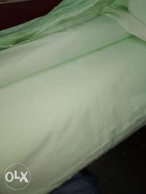 Light green plain color fabric of 67colttolb+33 polyester of