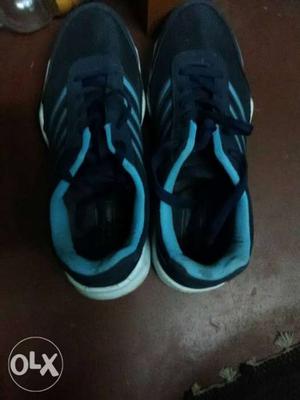 Pair Of Black-and-blue Running Shoes. Size 10.