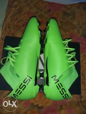 Pair Of Green Adidas Cleats