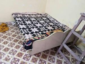 A bed with size 6.0 X 4.6 ft without mattress in good