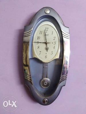 Gray Pedulum Clock