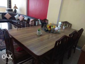 One 8 seat dining table with chairs. Used