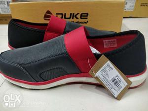 Pair Of Black-and-red Air Jordan Shoes