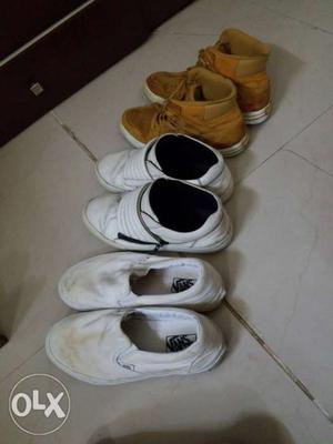 Three Pairs Of White And Brown Shoes