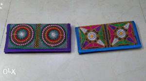 Two Blue And Multicolored Long Wallets