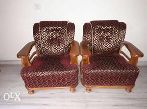 Two Brown Floral Padded Wooden Framed Armchairs