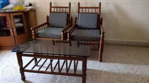 Two Brown Framed Gray Padded Armchairs