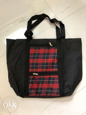 Black carry bag with enough storage space.