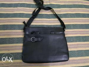 Black leather sling bag, good condition