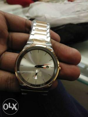 Golden silver color watch time and date both