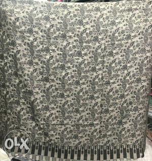 Gray And Black Floral Textile