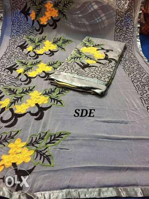Gray And Yellow Floral Textile