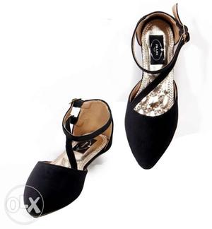 Pair Of Black Suede Ankle Strap Flat Shoes
