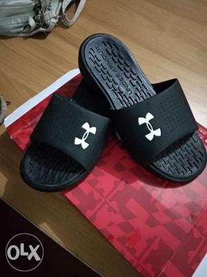 Pair Of Black Under Armour Slide Sandals