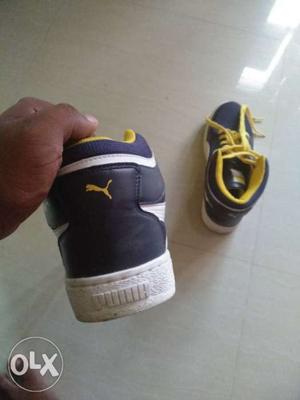 Pair Of Black-and-yellow Basketball Shoes