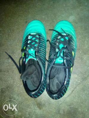 Pair Of Teal-and-black Nike Running Shoes