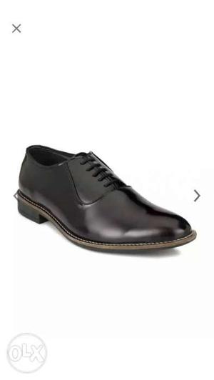 Paired Black Leather Dress Shoe