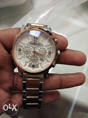 Round gold coloured chronograph watch