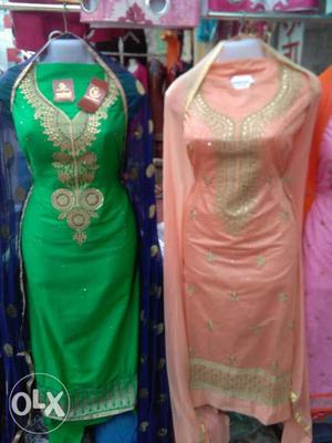 Two Orange And Green Traditional Dresses