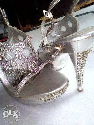 Very beautiful silver high heels with stones on