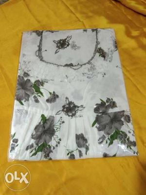 White And Black Floral Textile