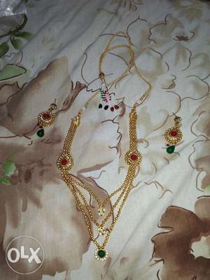 A pair of ear rings and a necklace