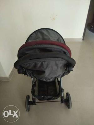 Baby's Black And Pink Stroller