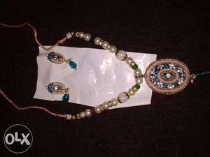 Beaded White And Gold-colored Necklace And Pair Of Earrings