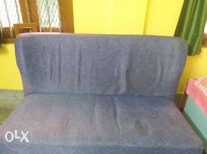 Gray Fabric Padded Sofa With Black Wooden Base