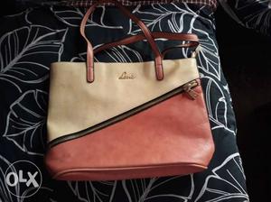 Lavie ladies handbag. Peach and off white in colour. 14 inch