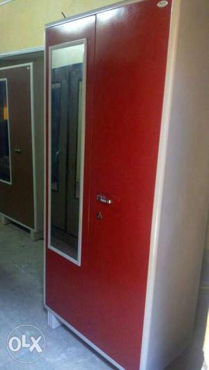 New red metal cupboard with mirror from factory